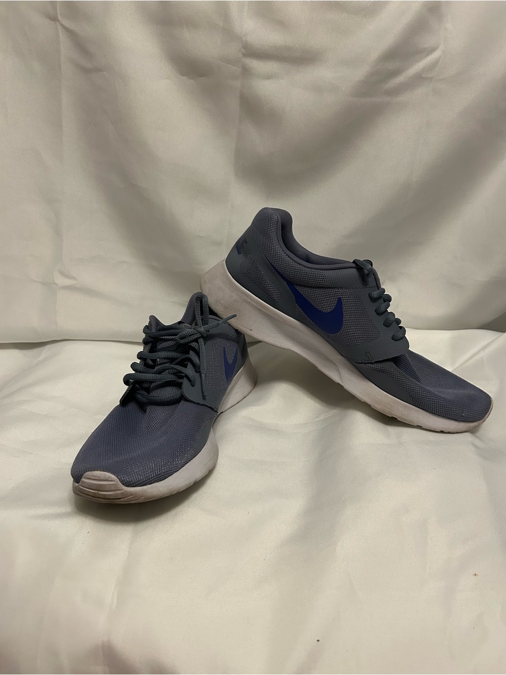 Nike Men's Gray Athletic Sneakers with Blue Swoosh